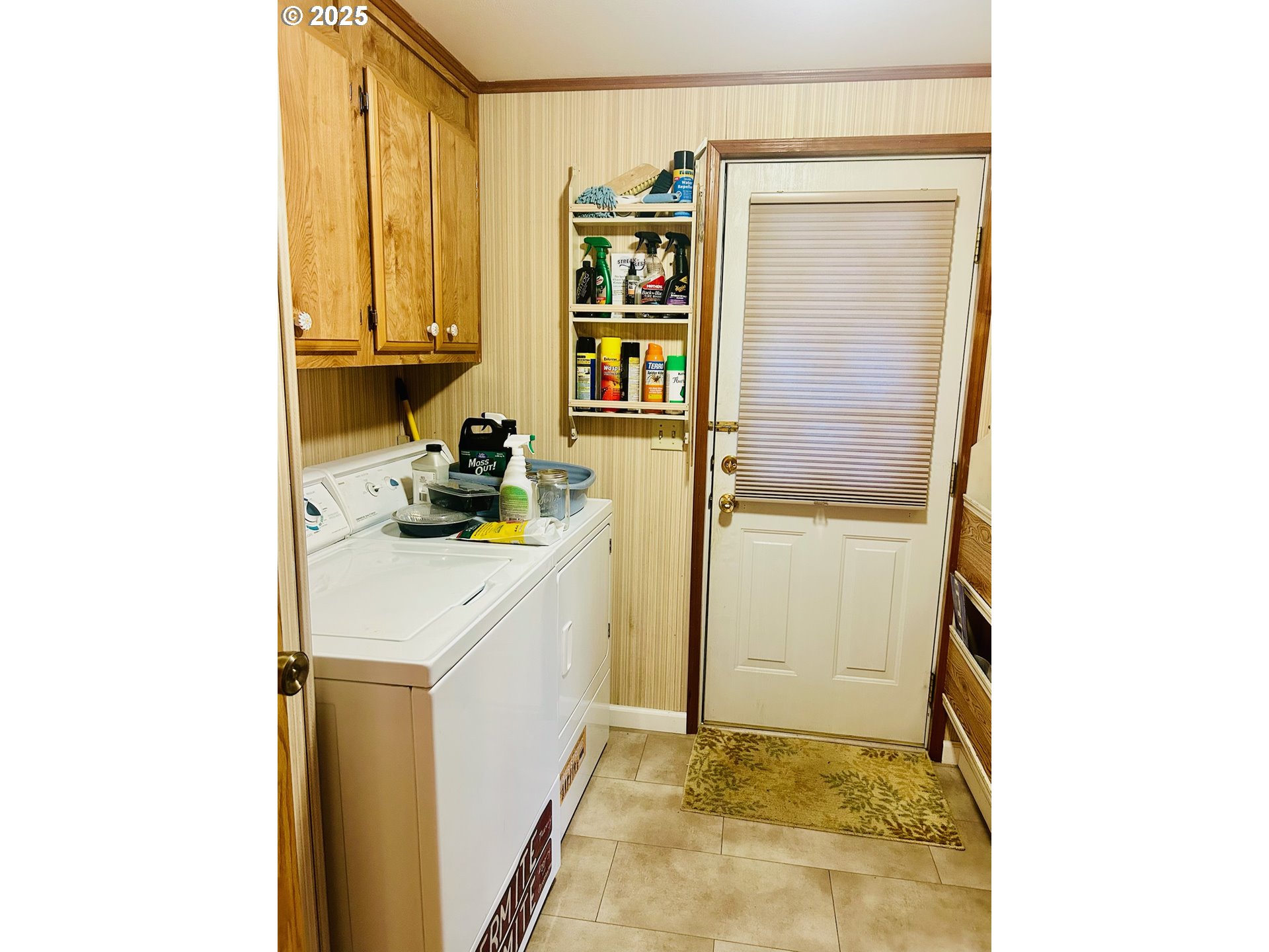 503 Southeast Sheridan Road, Unit 8 Sheridan, OR 97378 - Photo 32 of 38 a kitchen with a refrigerator and cabinets