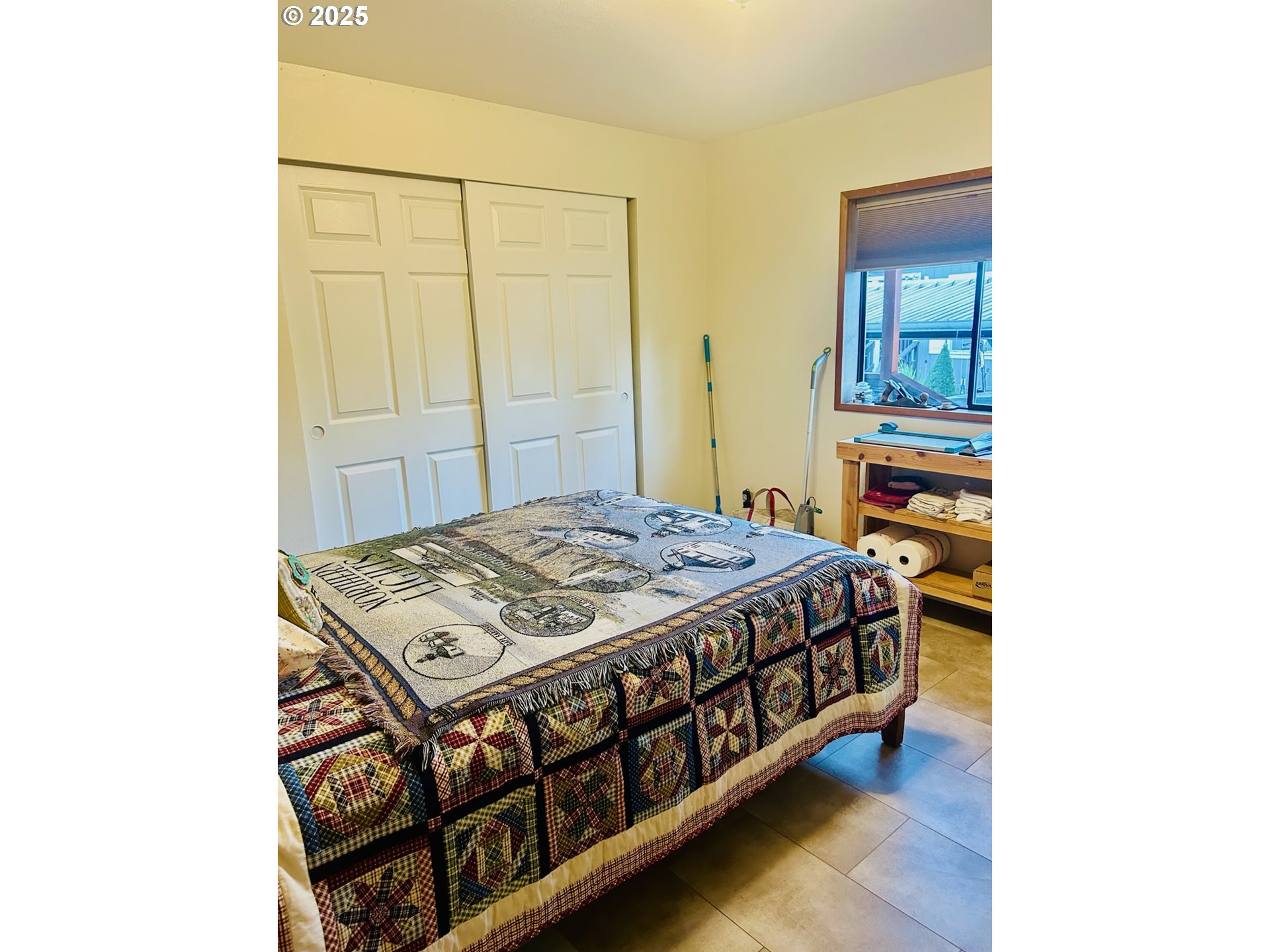 503 Southeast Sheridan Road, Unit 8 Sheridan, OR 97378 - Photo 33 of 38 a bed sitting in a bedroom next to a bathroom