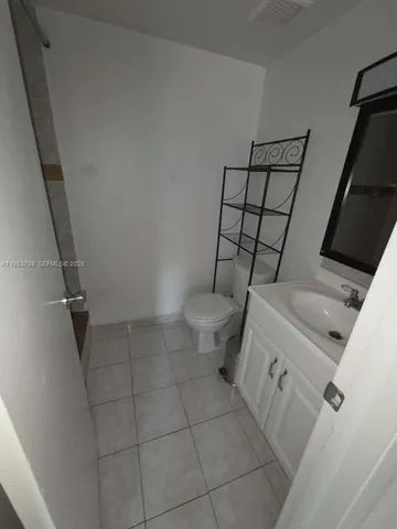 a bathroom with a sink and toilet
