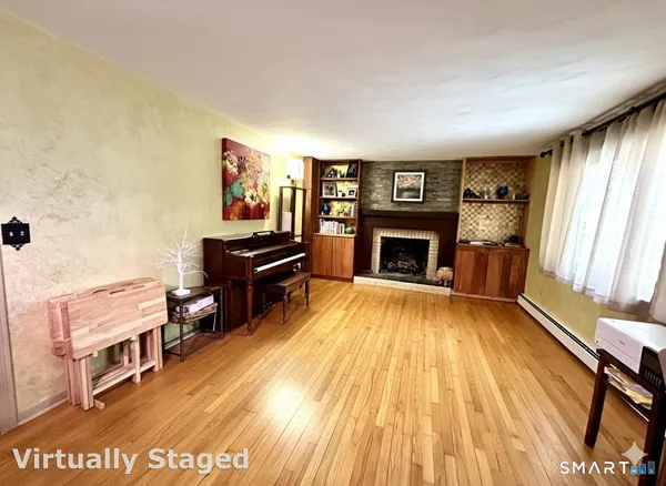 a living room with furniture and a fireplace