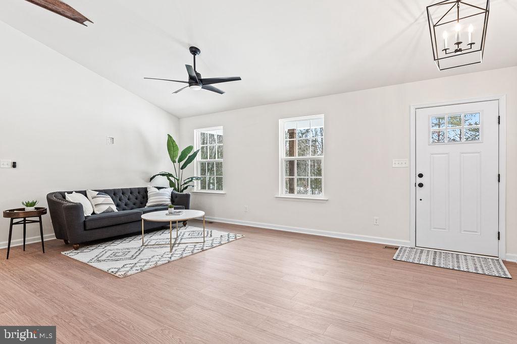 22366 Monrovia Road Orange, VA 22960 - Photo 24 of 53 a living room with furniture and a wooden floor