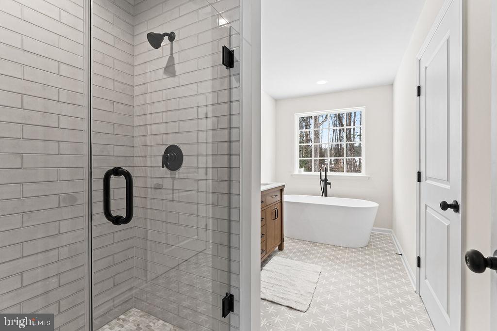 22366 Monrovia Road Orange, VA 22960 - Photo 7 of 53 a bathroom with a toilet bathtub and shower