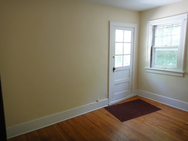 433 Normal Road DeKalb, IL 60115 - Photo 15 of 18 an empty room with wooden floor and windows