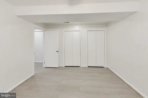 a view of room with hardwood floor