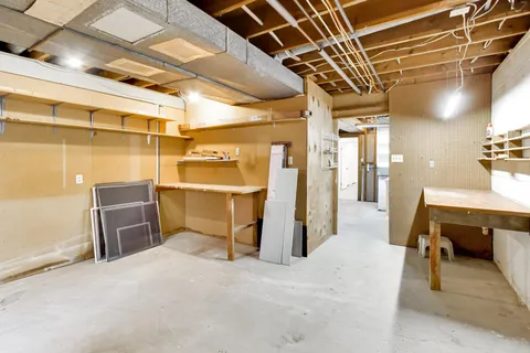 a view of a room with wooden furniture