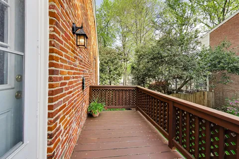 a view of a balcony with wooden floor