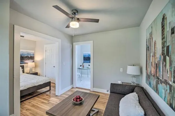 a bedroom with furniture and a rug