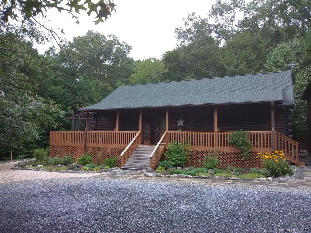 308 Cinnamon Ridge Rutherfordton, NC 28139 - Photo 1 of 19 a front view of a house with garden