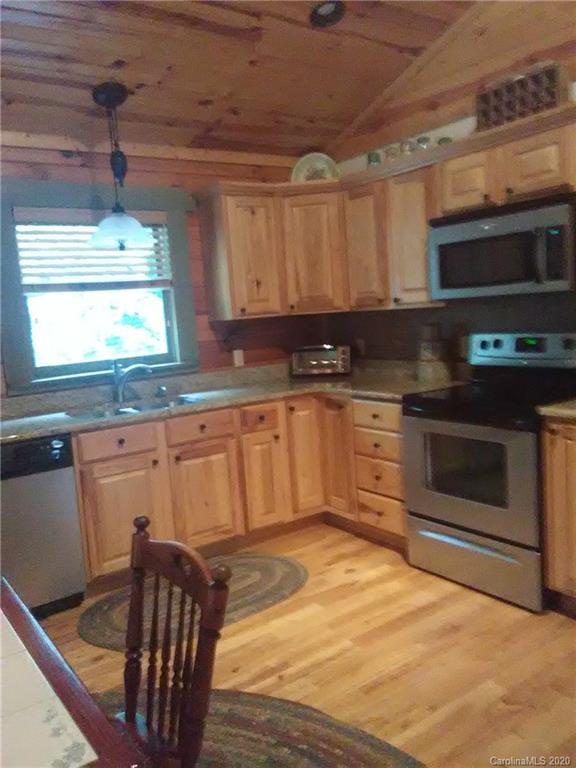 308 Cinnamon Ridge Rutherfordton, NC 28139 - Photo 15 of 19 a kitchen with stainless steel appliances granite countertop a stove a sink and a microwave