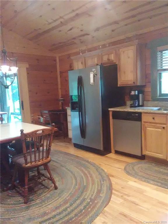 308 Cinnamon Ridge Rutherfordton, NC 28139 - Photo 16 of 19 a kitchen with a table and a refrigerator