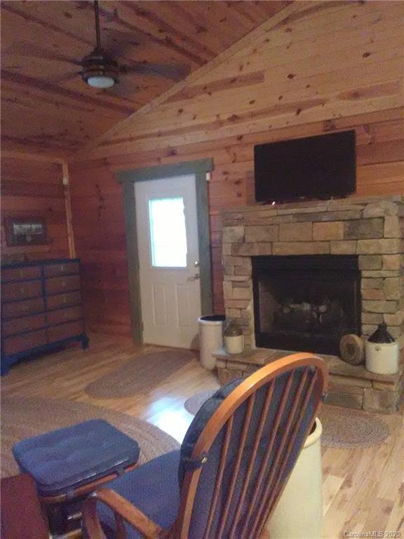 308 Cinnamon Ridge Rutherfordton, NC 28139 - Photo 18 of 19 a living room with furniture flat screen tv and a fireplace