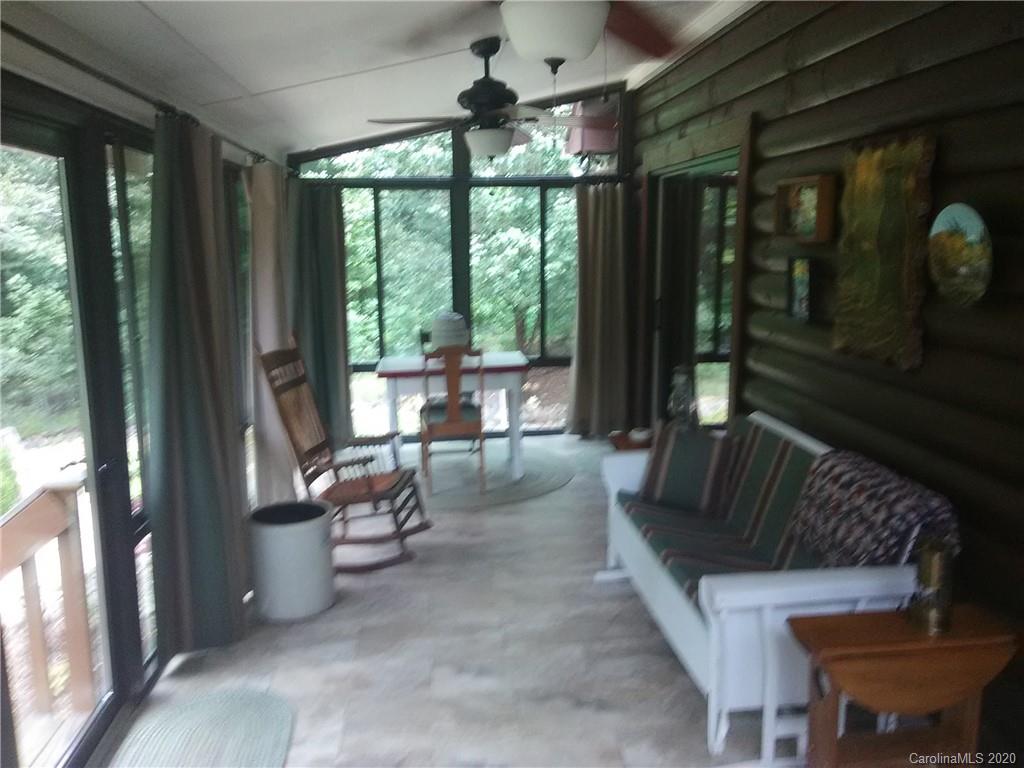 308 Cinnamon Ridge Rutherfordton, NC 28139 - Photo 19 of 19 a living room with patio furniture and a floor to ceiling window