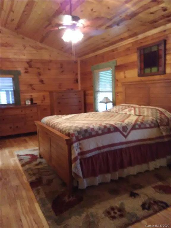 308 Cinnamon Ridge Rutherfordton, NC 28139 - Photo 6 of 19 a bedroom with a bed and a chandelier