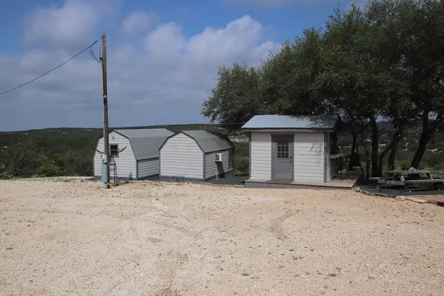 a bedroom with furniture and a flat screen tv