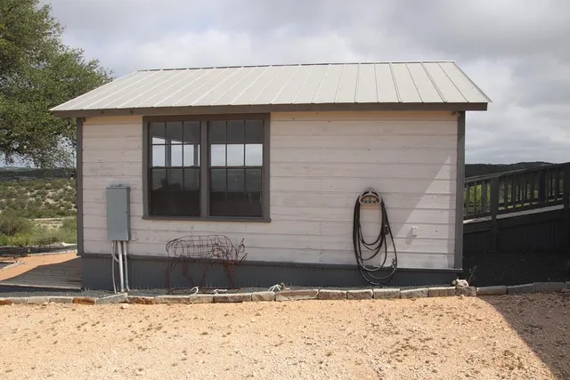 a bed room with two beds and a chandelier