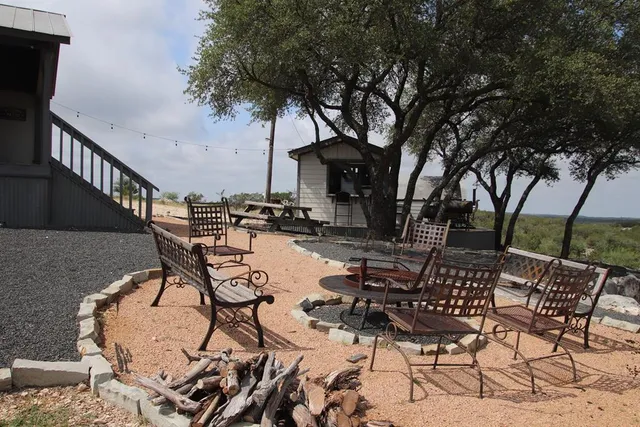 a view of a living room and floor to ceiling window and wooden floor