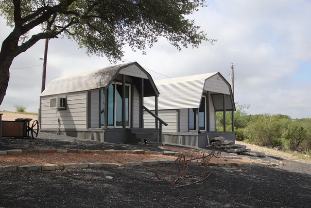 a view of a yard with an outdoor seating