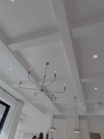 a backyard of a house with barbeque oven and outdoor seating