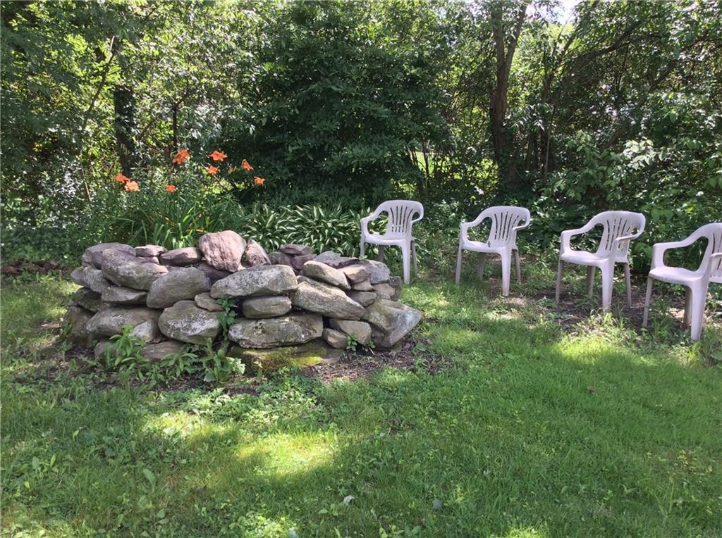 116 Hampton Court Butler, PA 16002 - Photo 25 of 25 An inviting fire pit sits at the edge of the property and is a cool place to enjoy summer evenings.