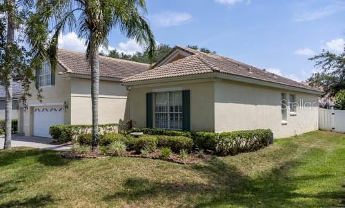 65 Calliope Street Ocoee, FL 34761 - Photo 59 of 60 a front view of a house with a yard