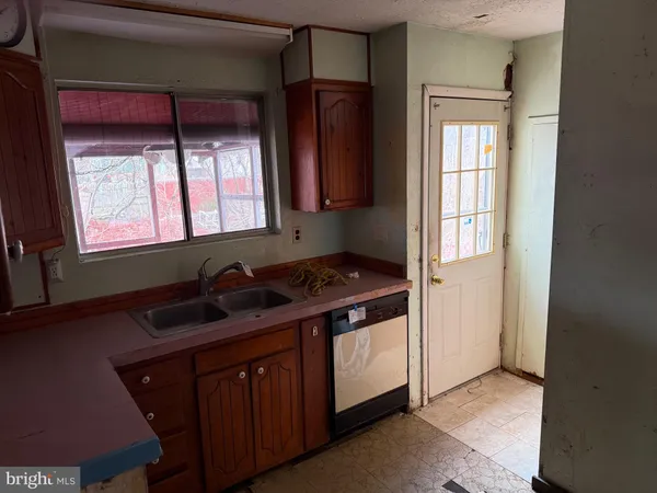 a kitchen with a stove and a cabinet