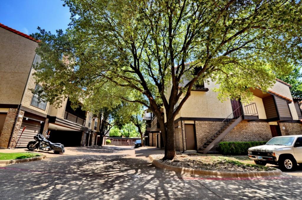 5630 Spring Valley Road, Unit 23A Dallas, TX 75254 - Photo 1 of 18 a car parked in front of a house