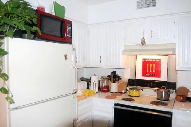 a kitchen with a stove and a microwave