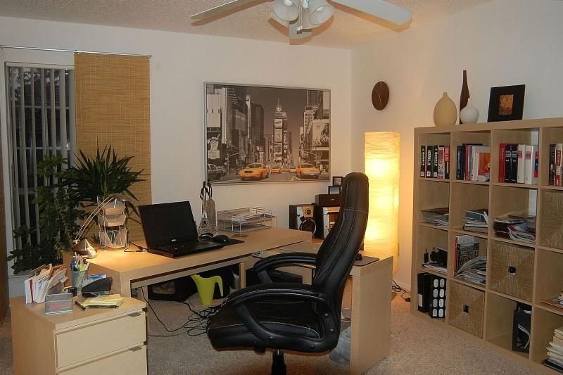 5630 Spring Valley Road, Unit 23A Dallas, TX 75254 - Photo 17 of 18 a view of a workspace with furniture and a bookshelf