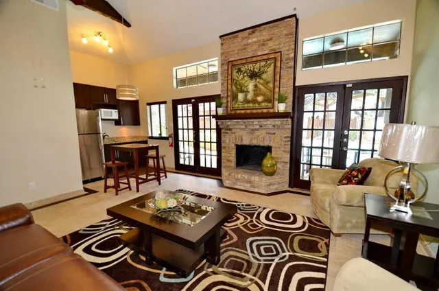 a living room with furniture and a fireplace