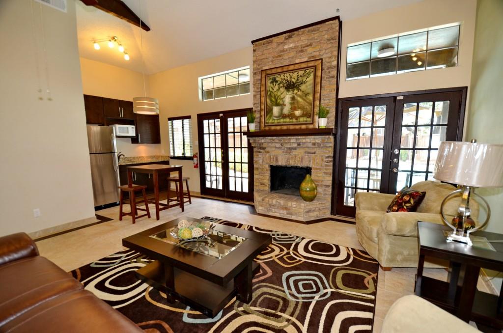 5630 Spring Valley Road, Unit 23A Dallas, TX 75254 - Photo 4 of 18 a living room with furniture and a fireplace