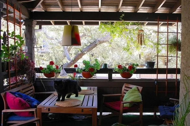 a outdoor living space with furniture and garden view