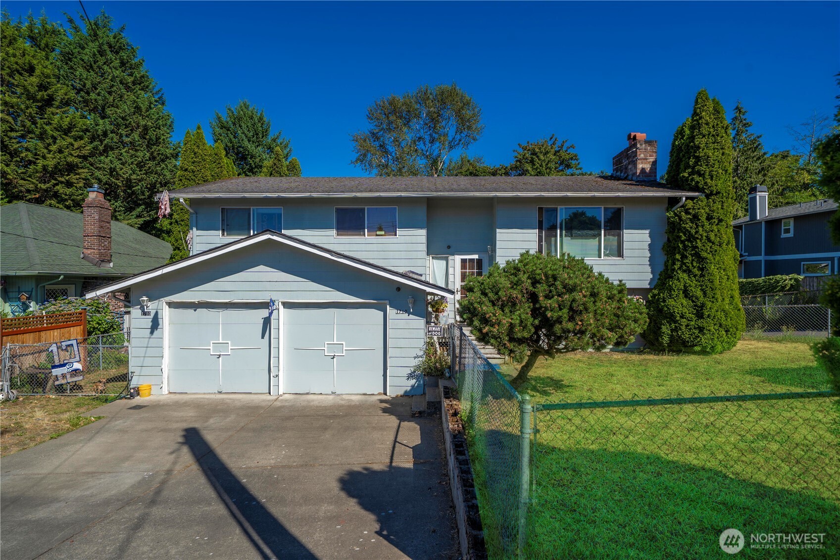 1710 Talbot Road South Renton, WA 98055 - Photo 1 of 1 a front view of a house with a garden
