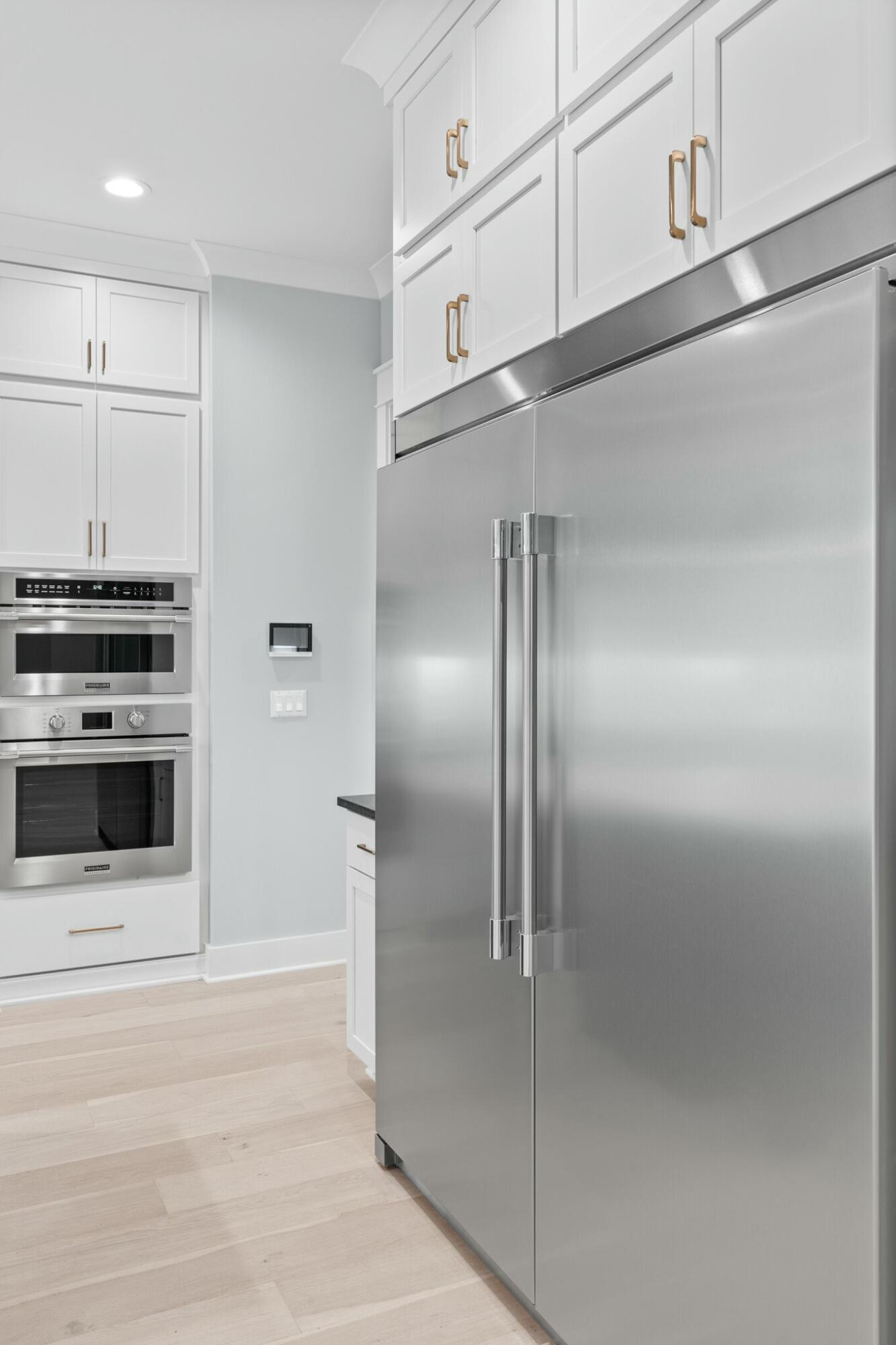 73 Sparkle Street Freeport, FL 32439 - Photo 13 of 27 a kitchen with stainless steel appliances granite countertop a refrigerator and a stove top oven