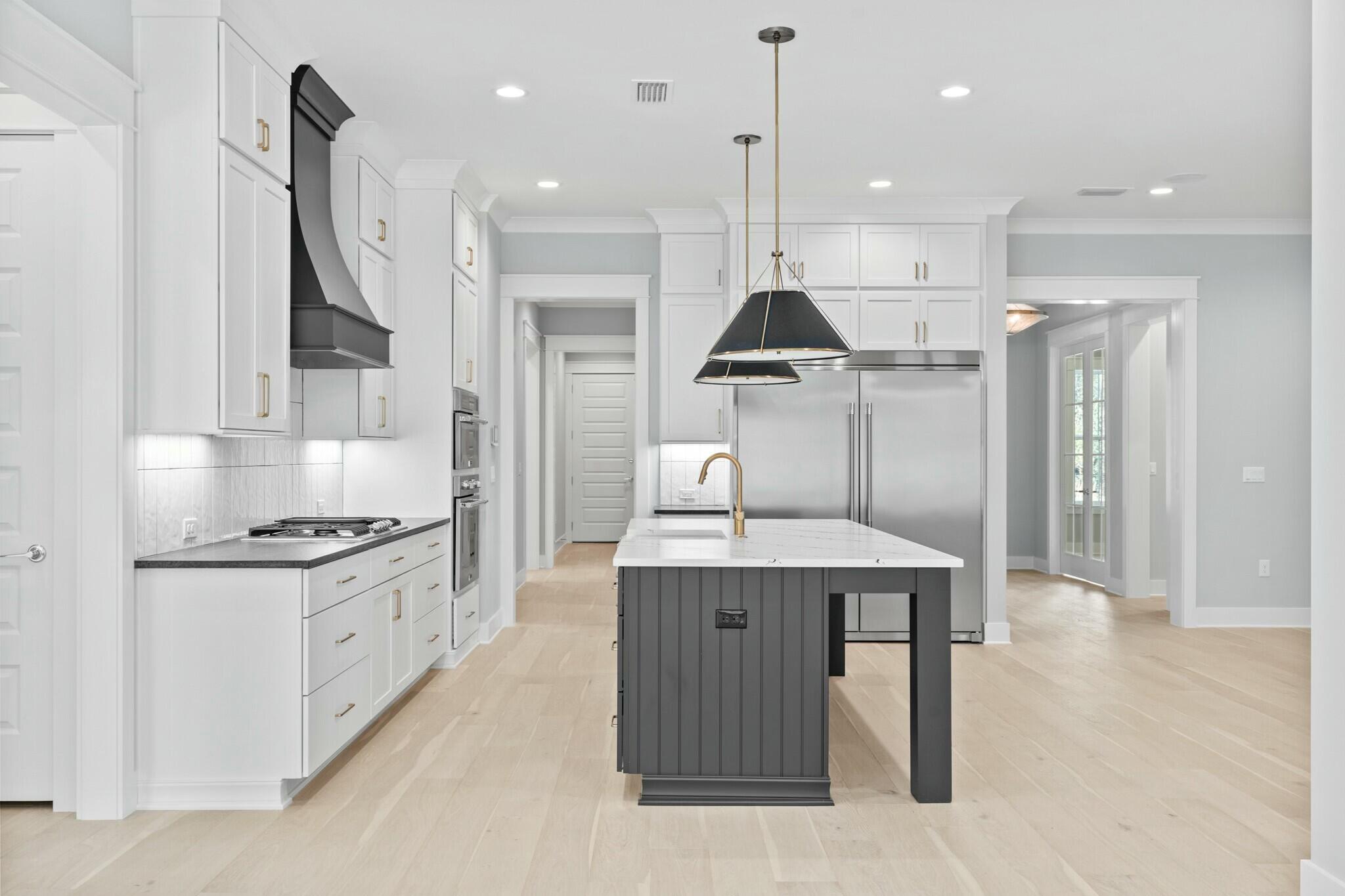 73 Sparkle Street Freeport, FL 32439 - Photo 18 of 27 a kitchen with stainless steel appliances granite countertop a sink a stove and a refrigerator