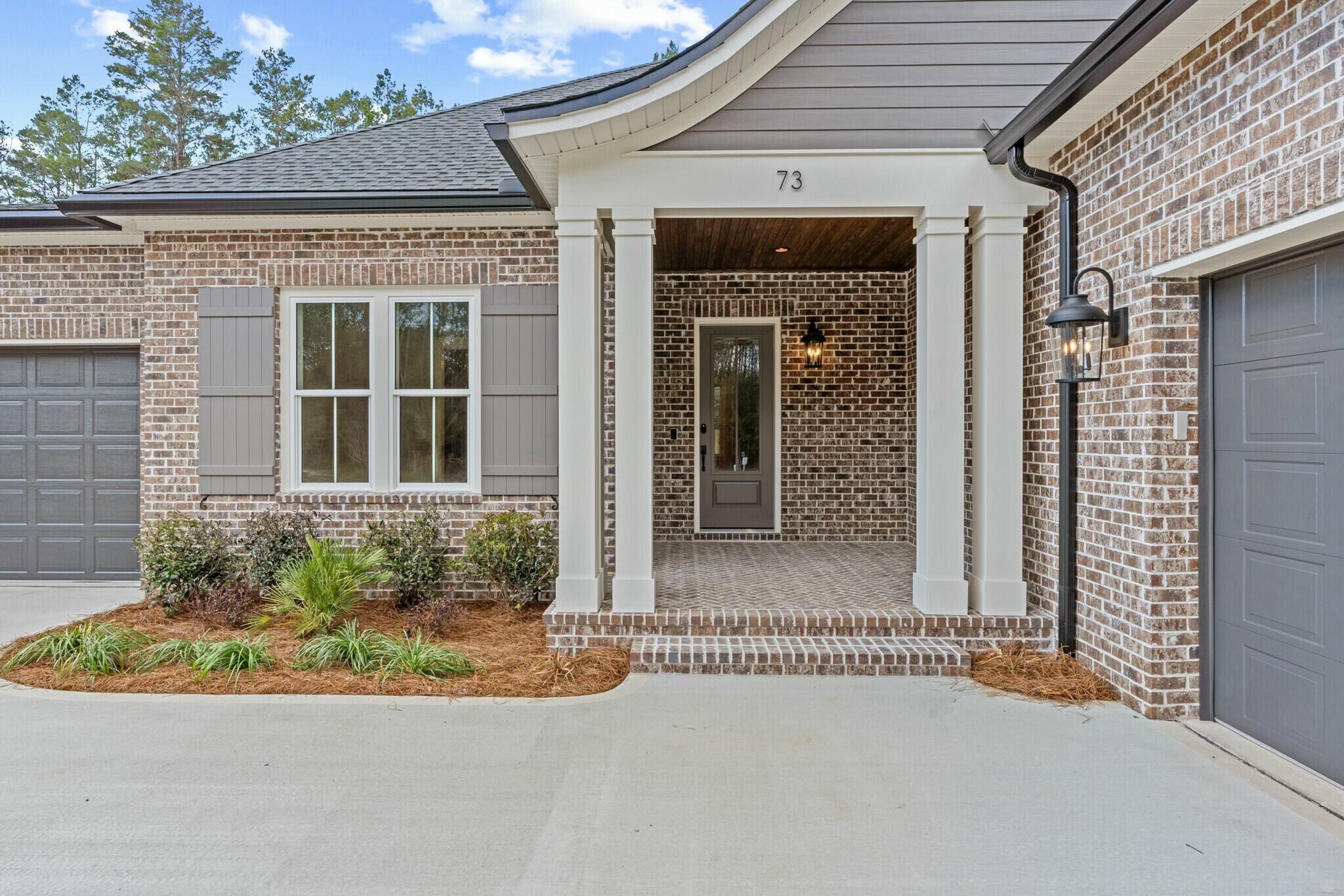 73 Sparkle Street Freeport, FL 32439 - Photo 2 of 27 front view of a house with a yard