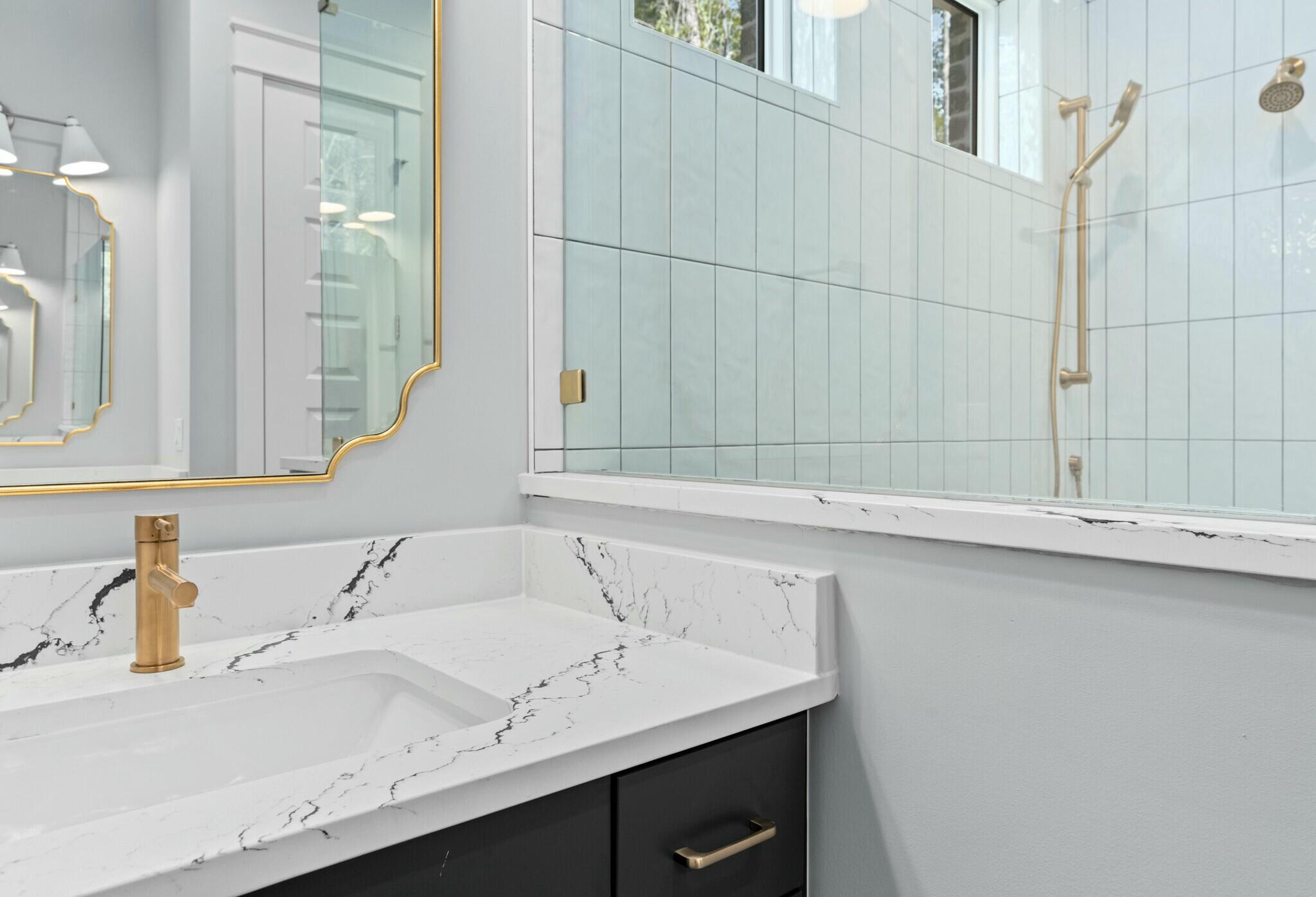 73 Sparkle Street Freeport, FL 32439 - Photo 23 of 27 a bathroom with a sink and a mirror