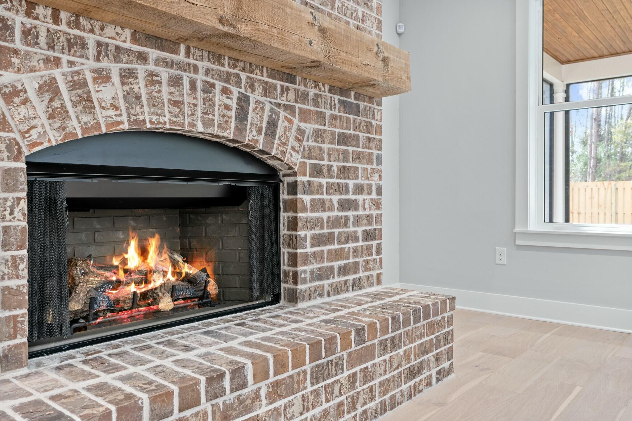 73 Sparkle Street Freeport, FL 32439 - Photo 5 of 27 a living room with a fireplace