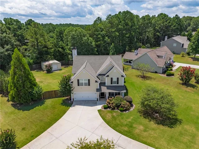 an aerial view of a house with garden