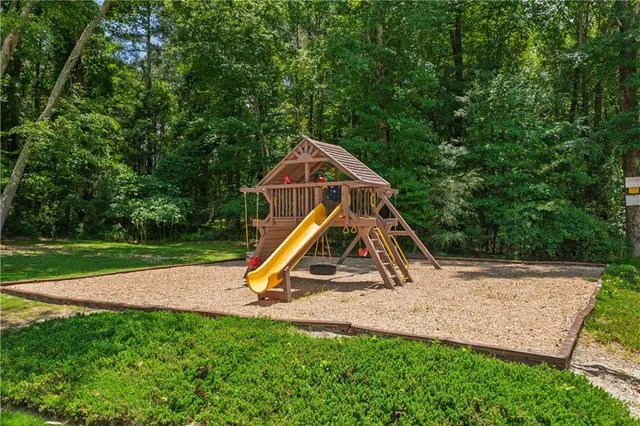 a view of park with a slide