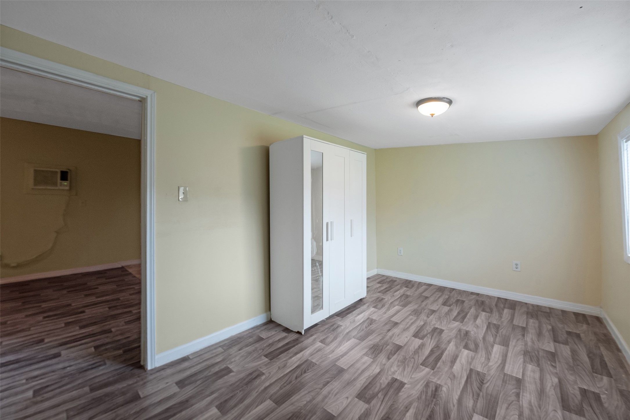 1614 Ryon Street, Unit B Houston, TX 77009 - Photo 15 of 17 wooden floor in an empty room with a window
