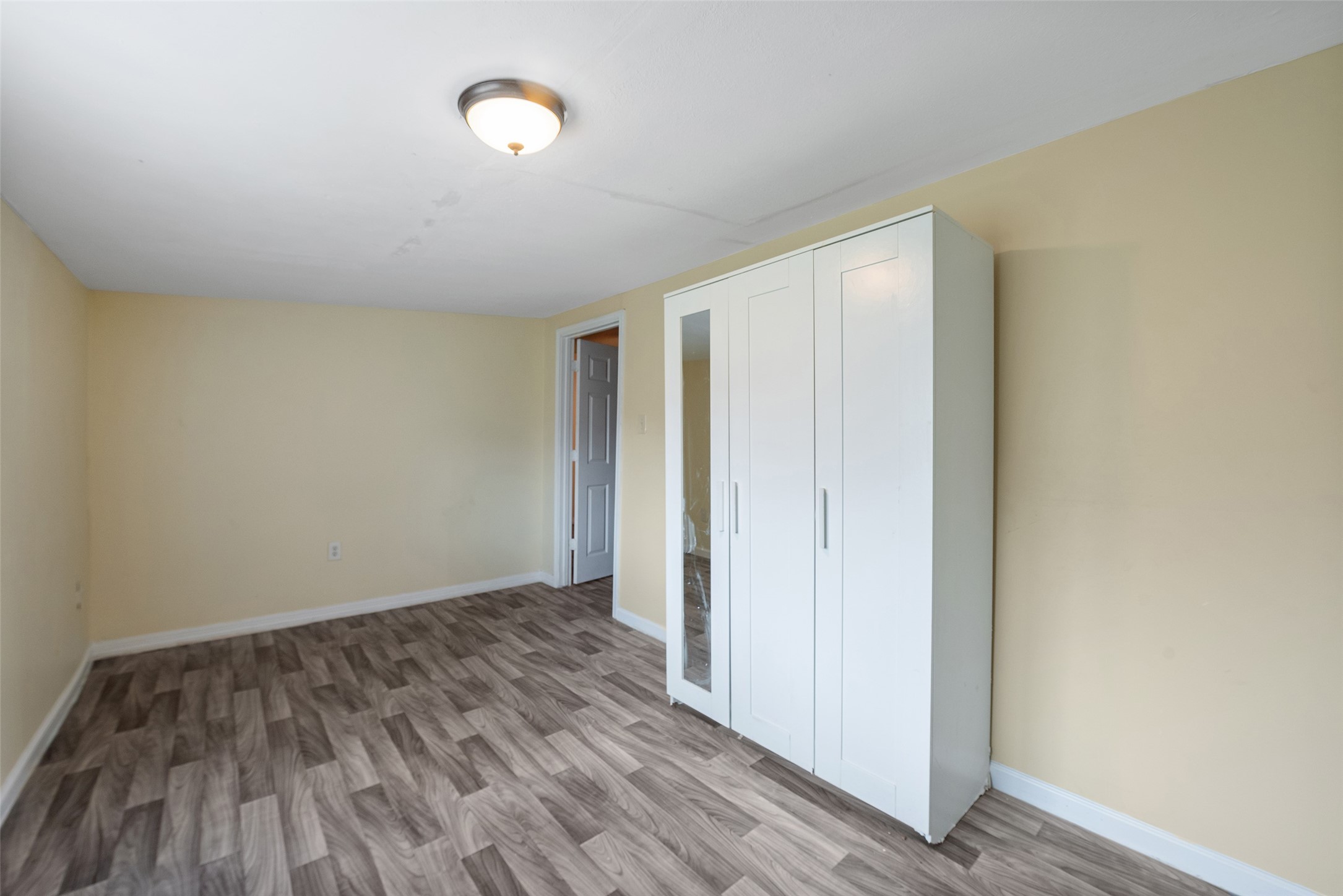 1614 Ryon Street, Unit B Houston, TX 77009 - Photo 16 of 17 a view of a room with wooden floor