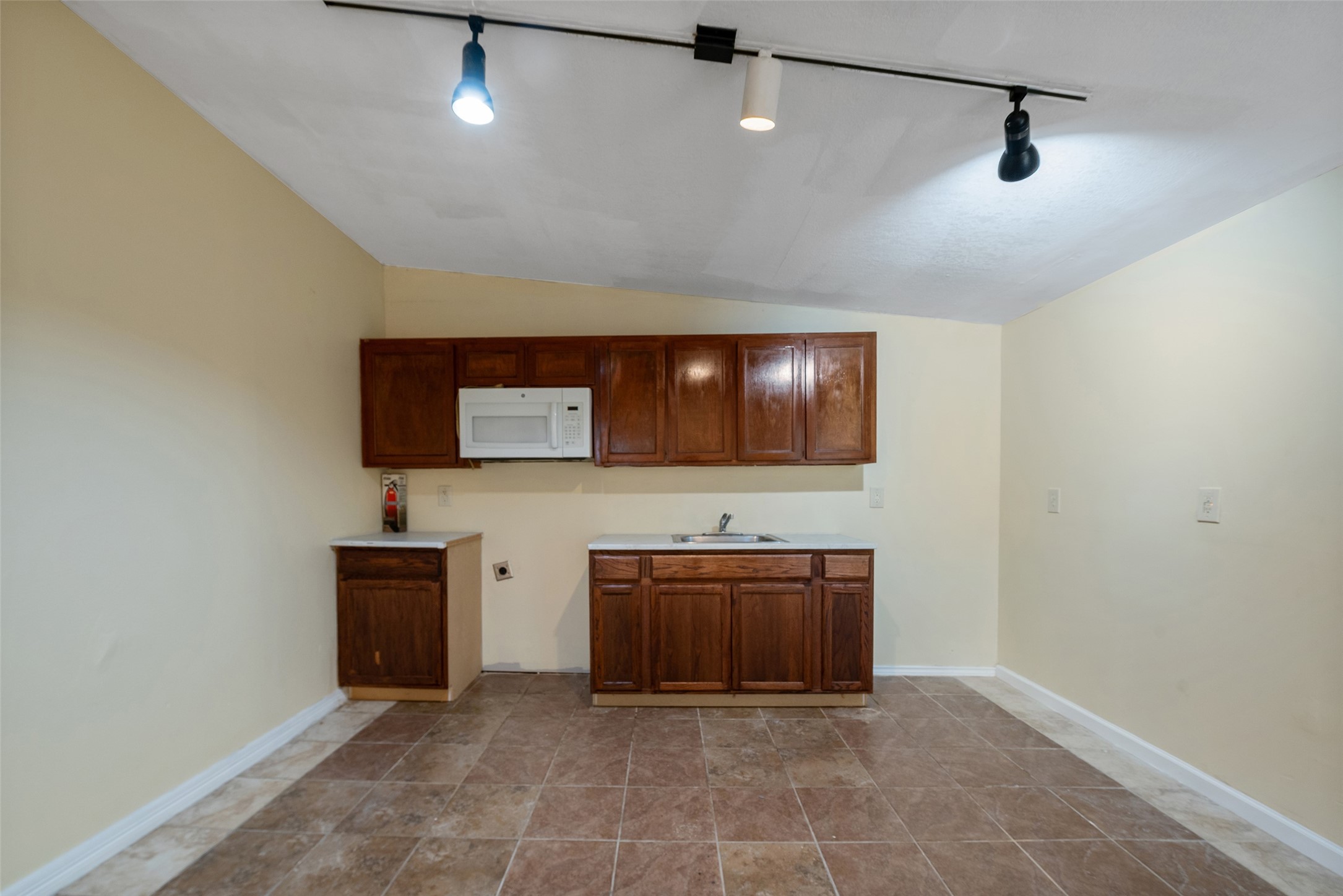 1614 Ryon Street, Unit B Houston, TX 77009 - Photo 10 of 17 a view of a storage and utility room with wooden floor