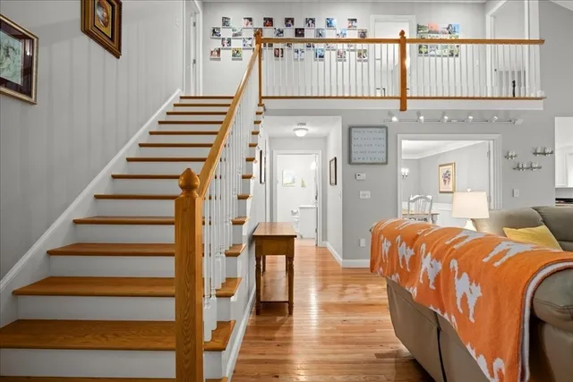 a front view of a house with wooden floor and windows