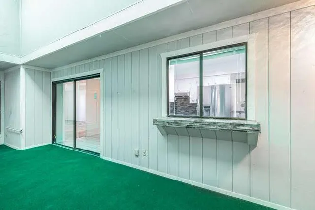 a view of a room that has a window in it