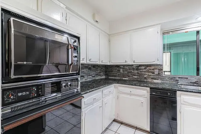 a kitchen with a stove and a microwave