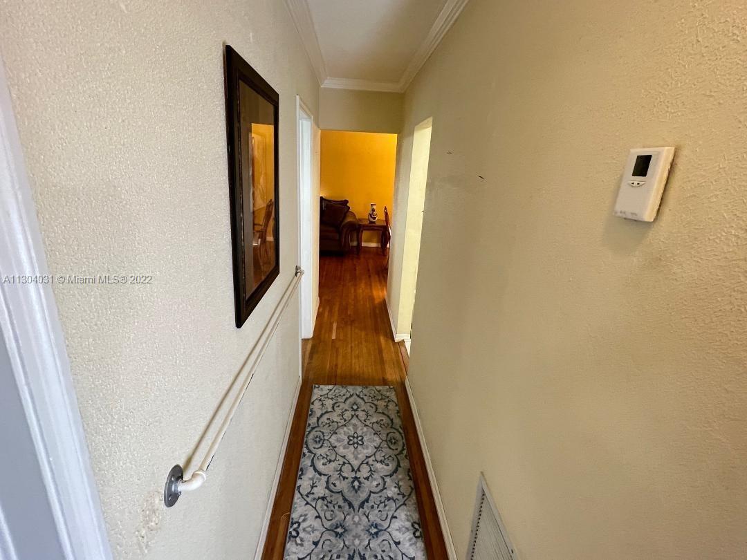 231 West 43rd Street Hialeah, FL 33012 - Photo 6 of 14 a view of hallway with wooden floor