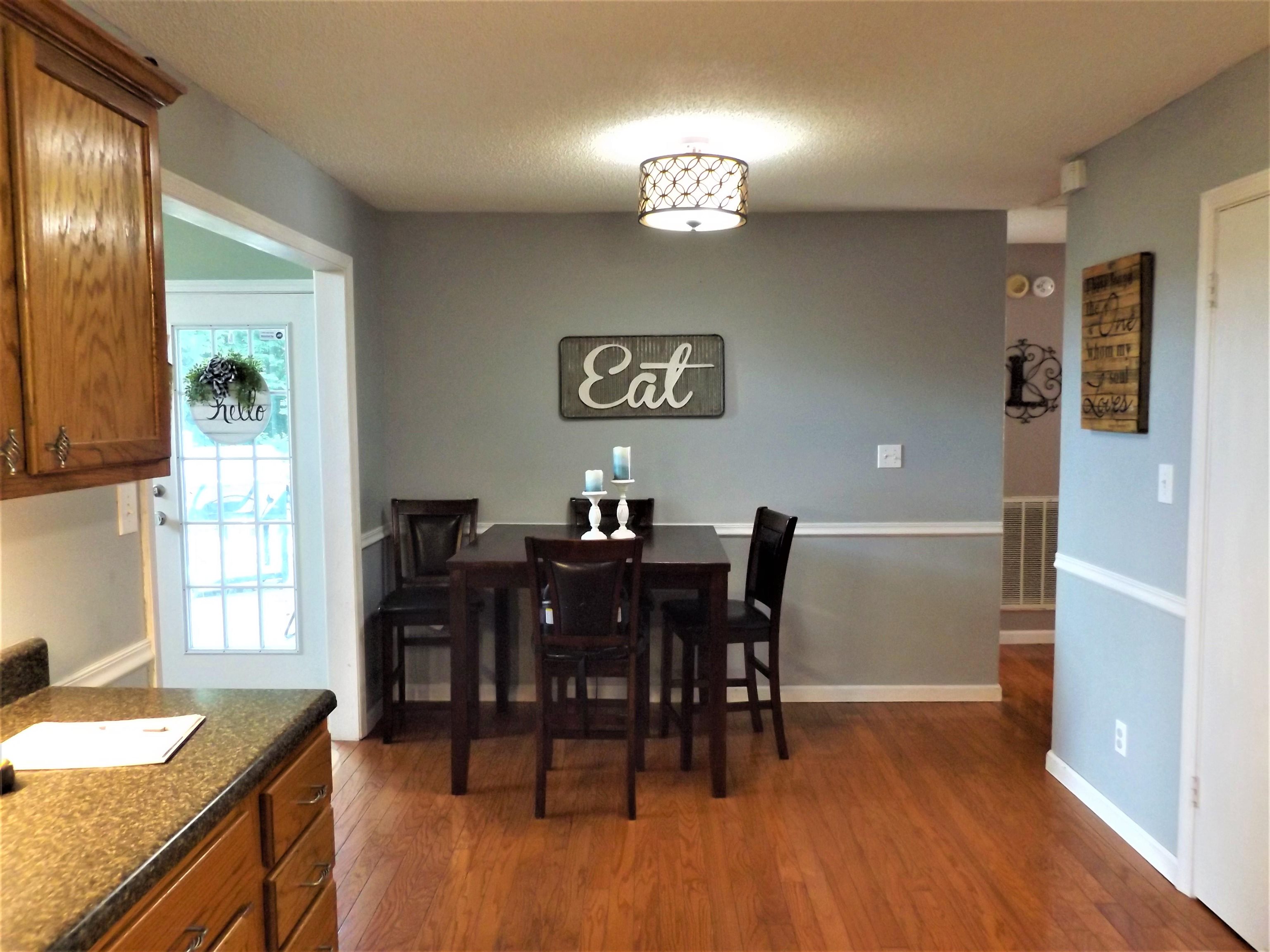 2930 Craig Road Ripley, TN 38063 - Photo 19 of 24 a view of a dining room with furniture and wooden floor