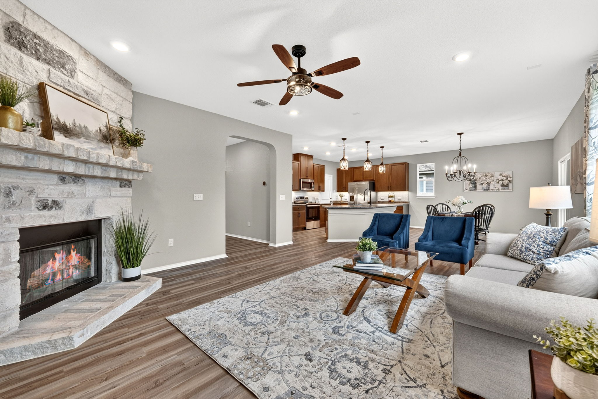 326 Linden Street Bastrop, TX 78602 - Photo 1 of 39 Large living room with cozy fireplace and LVP floors.