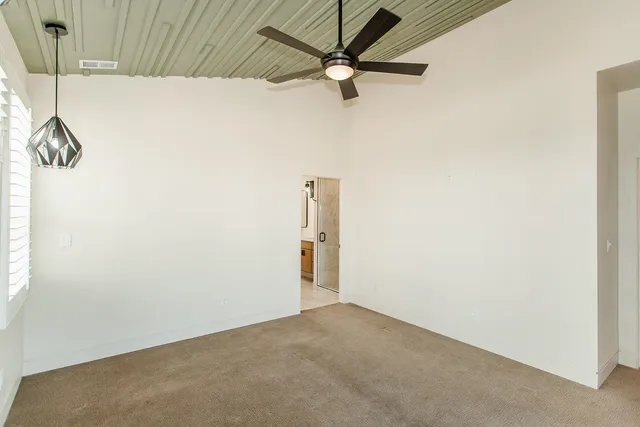 a view of a room with a fan
