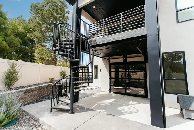 a view of a balcony with wooden floor and city view